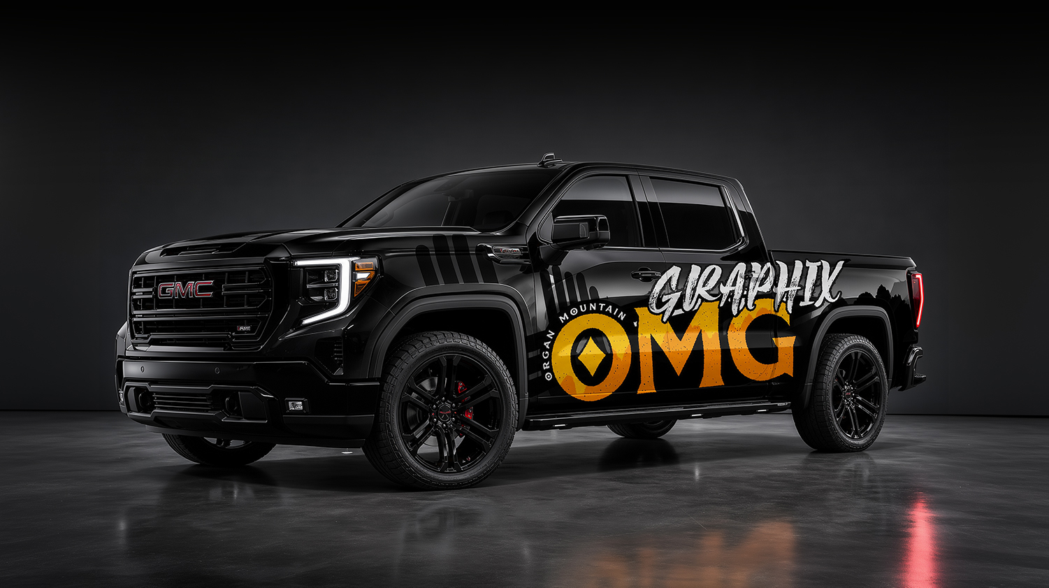 Black GMC Sierra wrapped with Organ Mountain Graphix branding